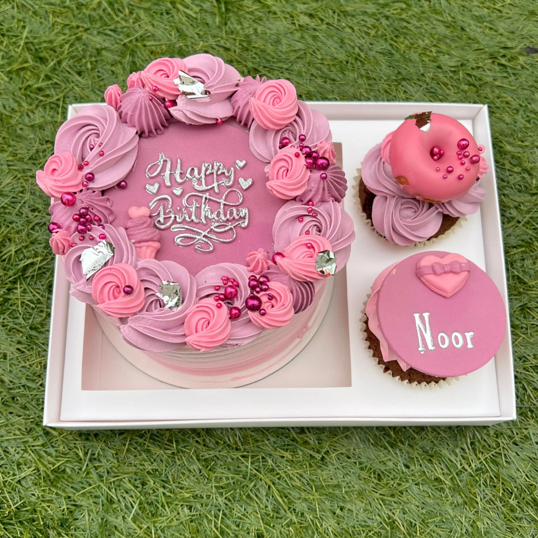 Pink and lilac bento cake with 2 cupcakes