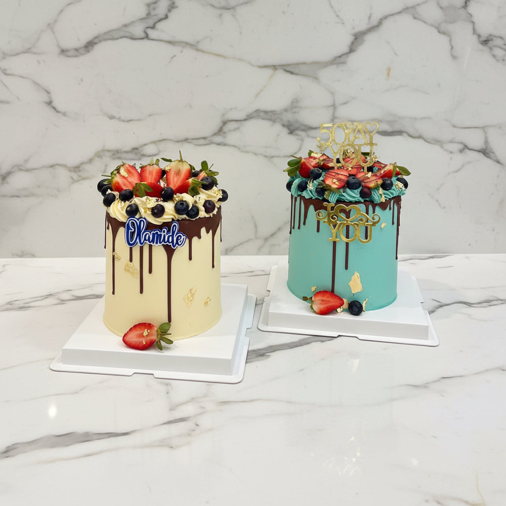 Two decorated cakes on a table