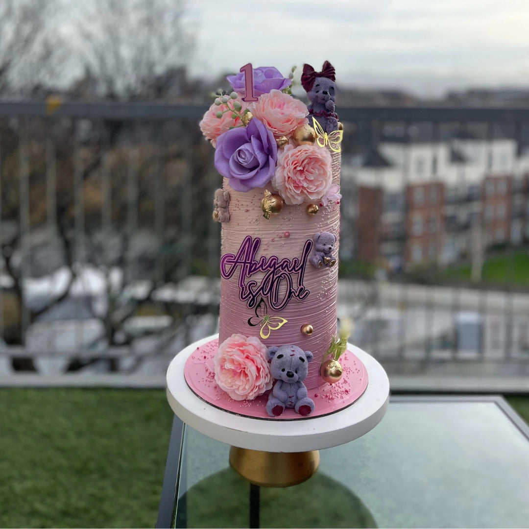 PINK ELEGANT CAKE WITH FONDANT TEDDY BEARS AND PINK AND LILAC FLOWERS