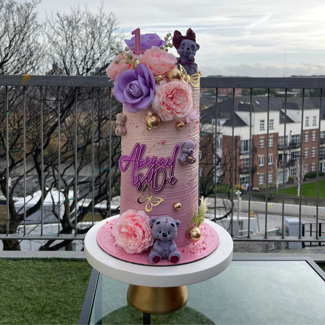 PINK ELEGANT CAKE WITH FONDANT TEDDY BEARS AND PINK AND LILAC FLOWERS