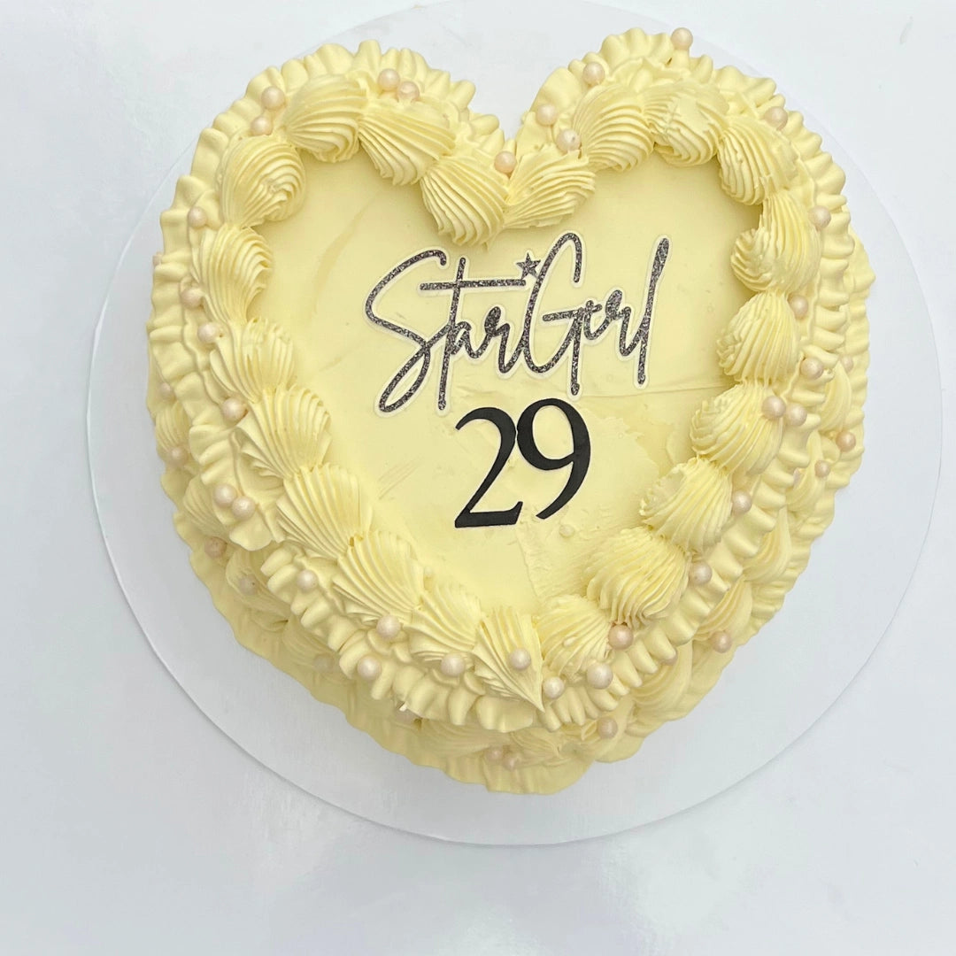 IVORY HEART CAKE WITH BLACK WRITING