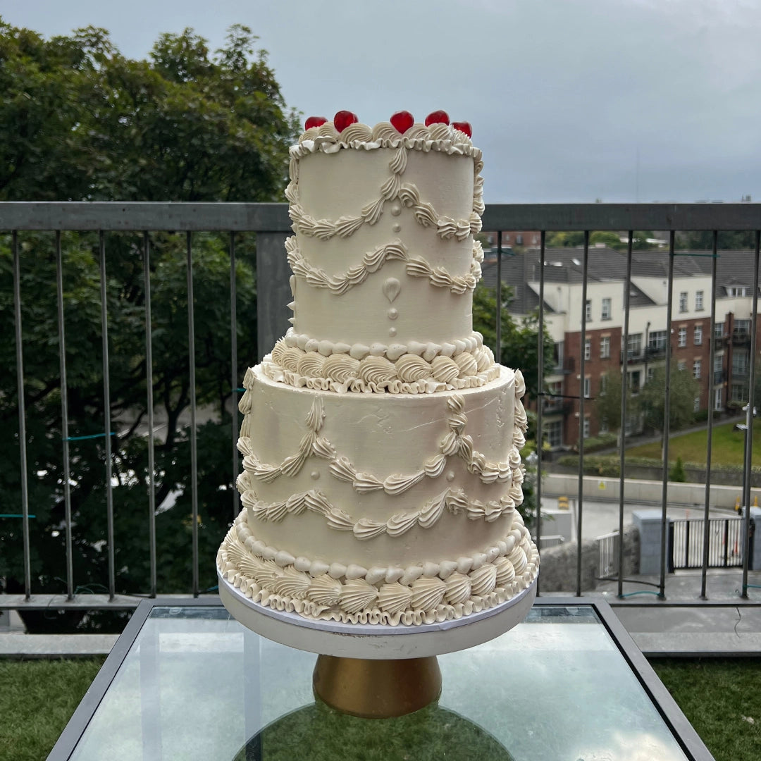 Ivory 2 tier buttercream wedding cake with cherries