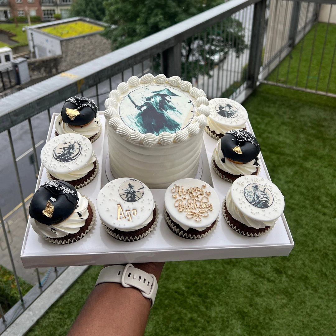 White and black Bento Cake with 8 cupcakes