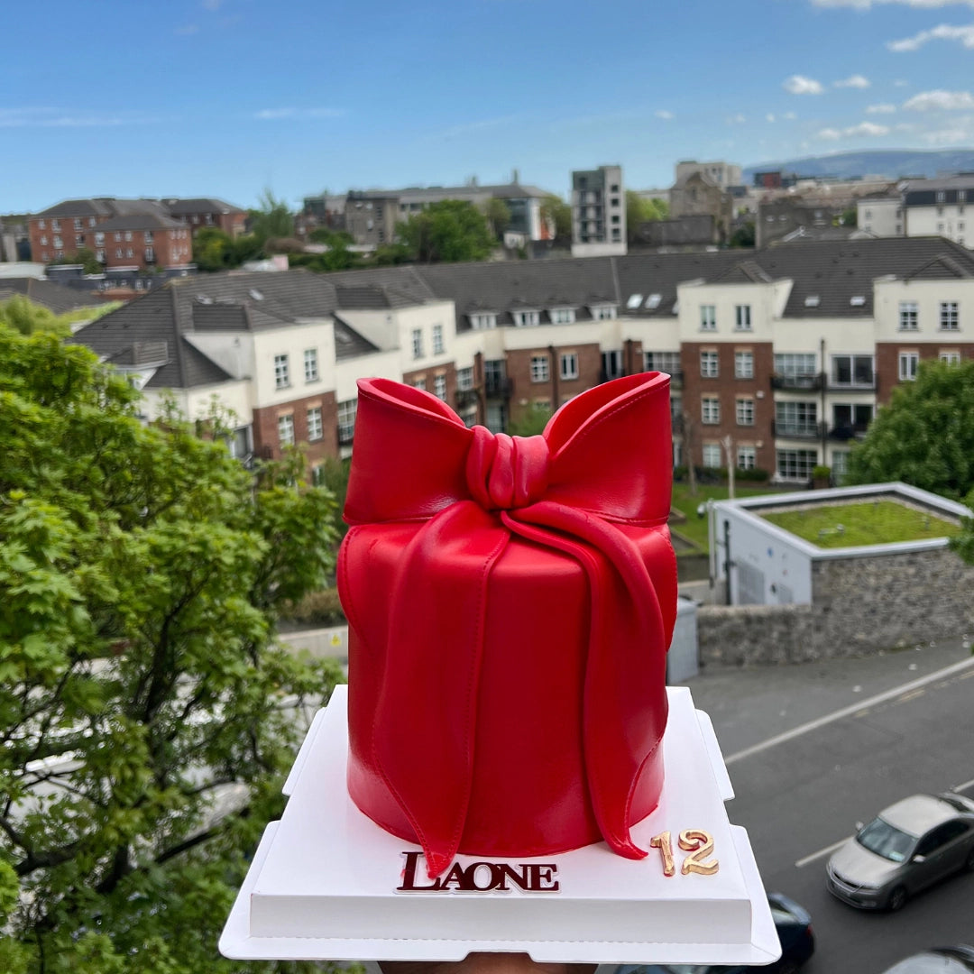 RED CAKE WITH A GIANT BOW