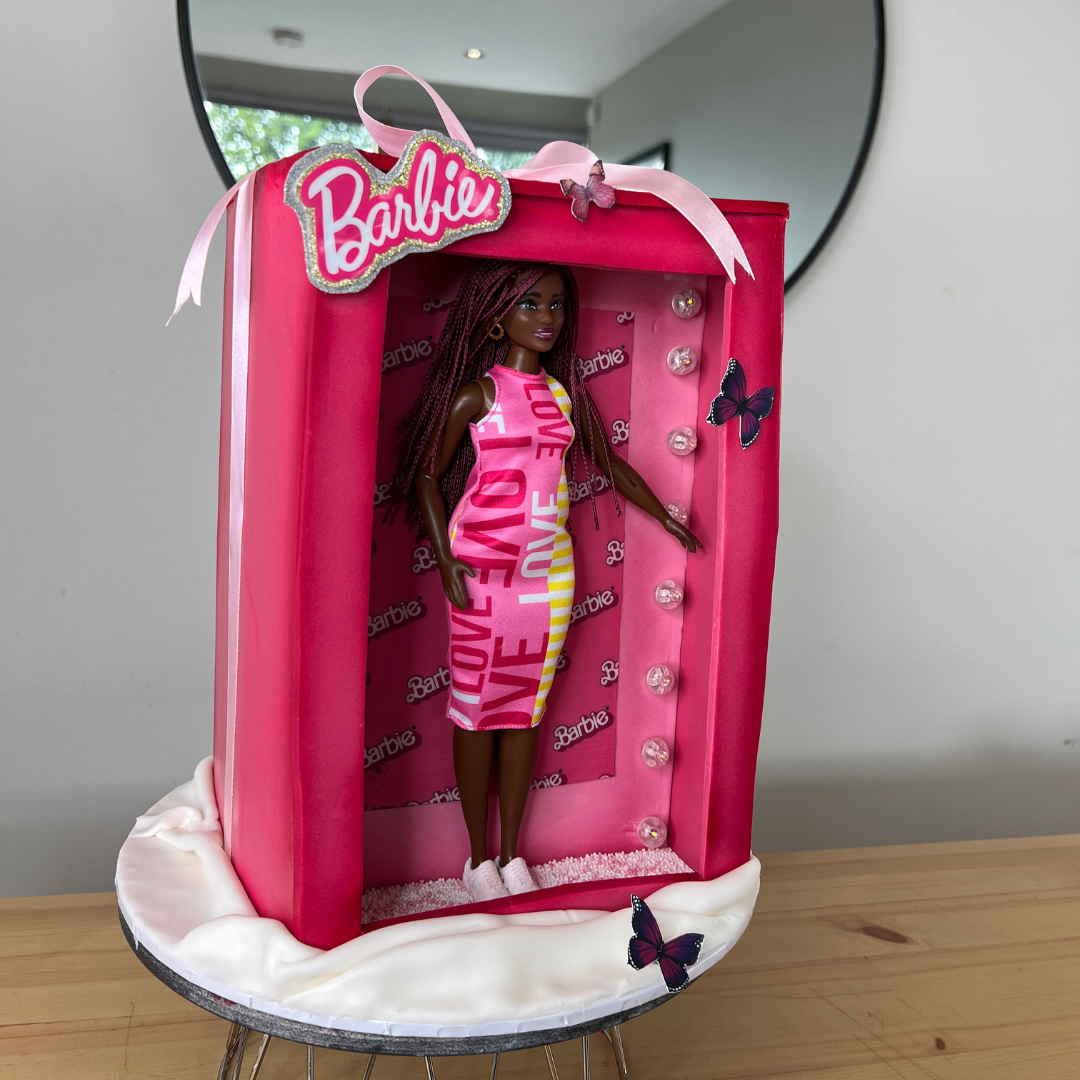 pink barbie in a cake