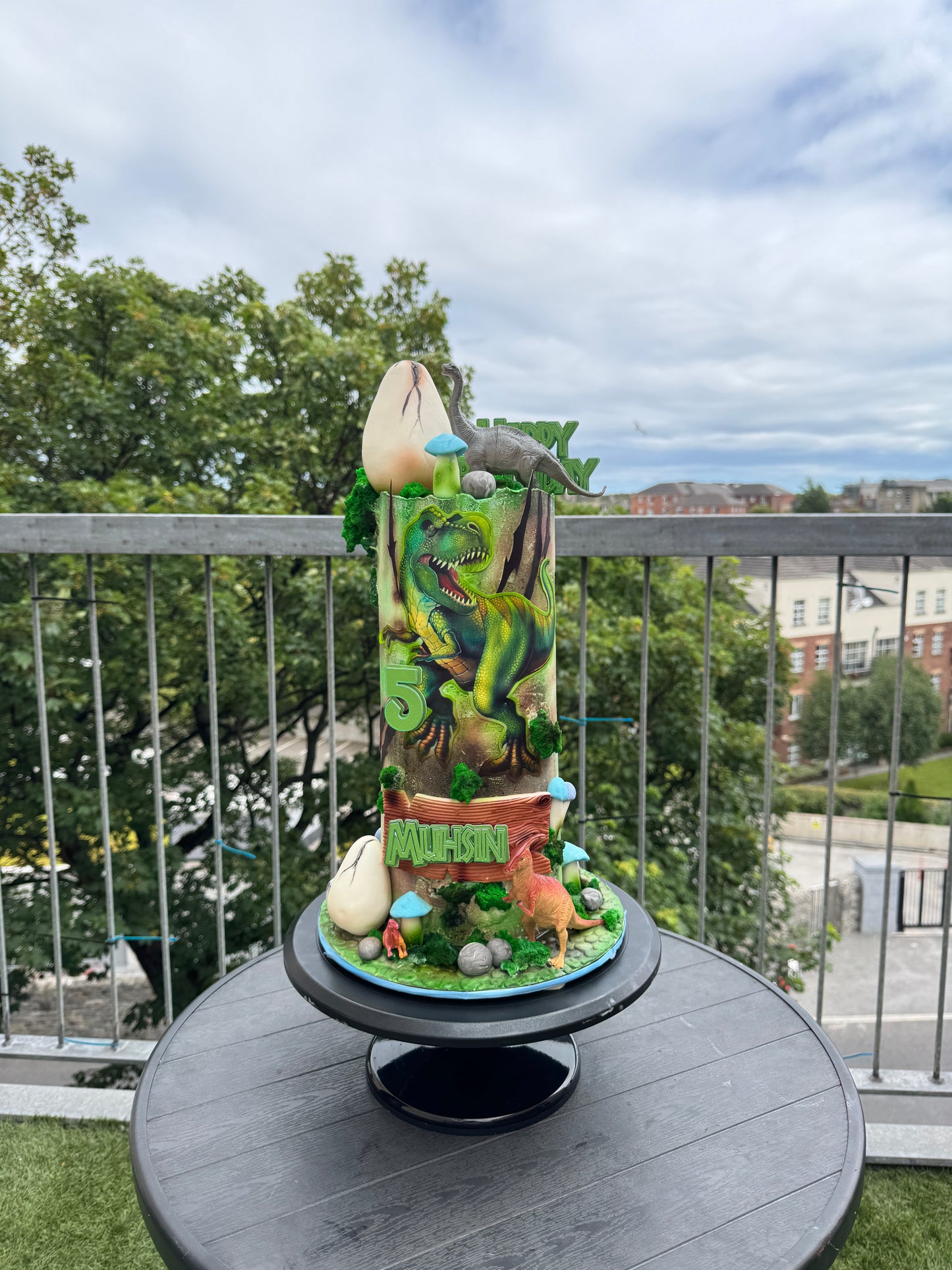 green prehistoric Tall dinosaur birthday cake