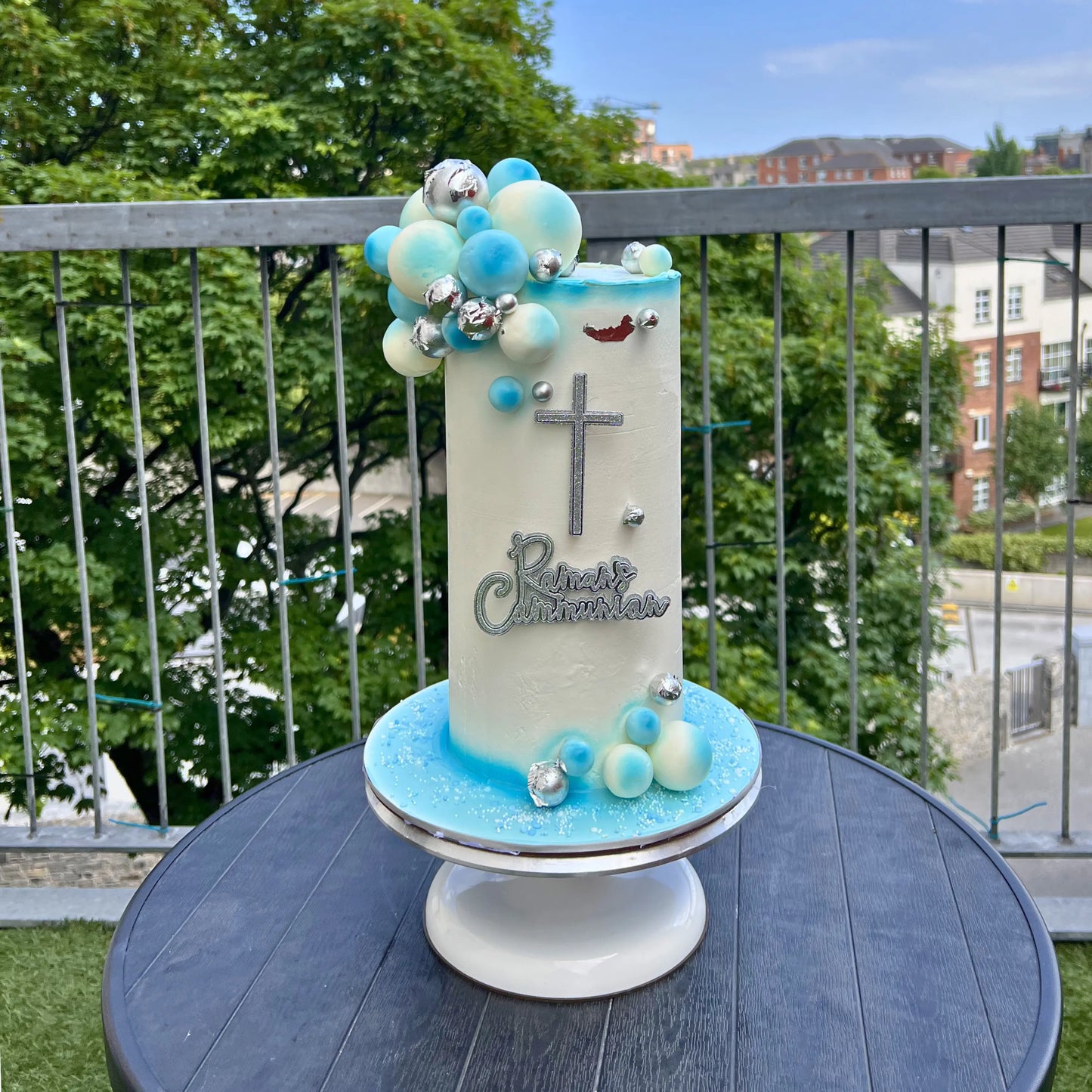 Decorative communion cake with a cross for christening