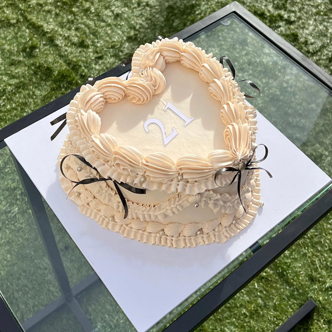 ivory love cake with black bows