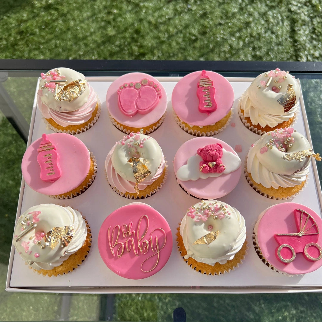 pink baby shower cupcakes with mini donuts