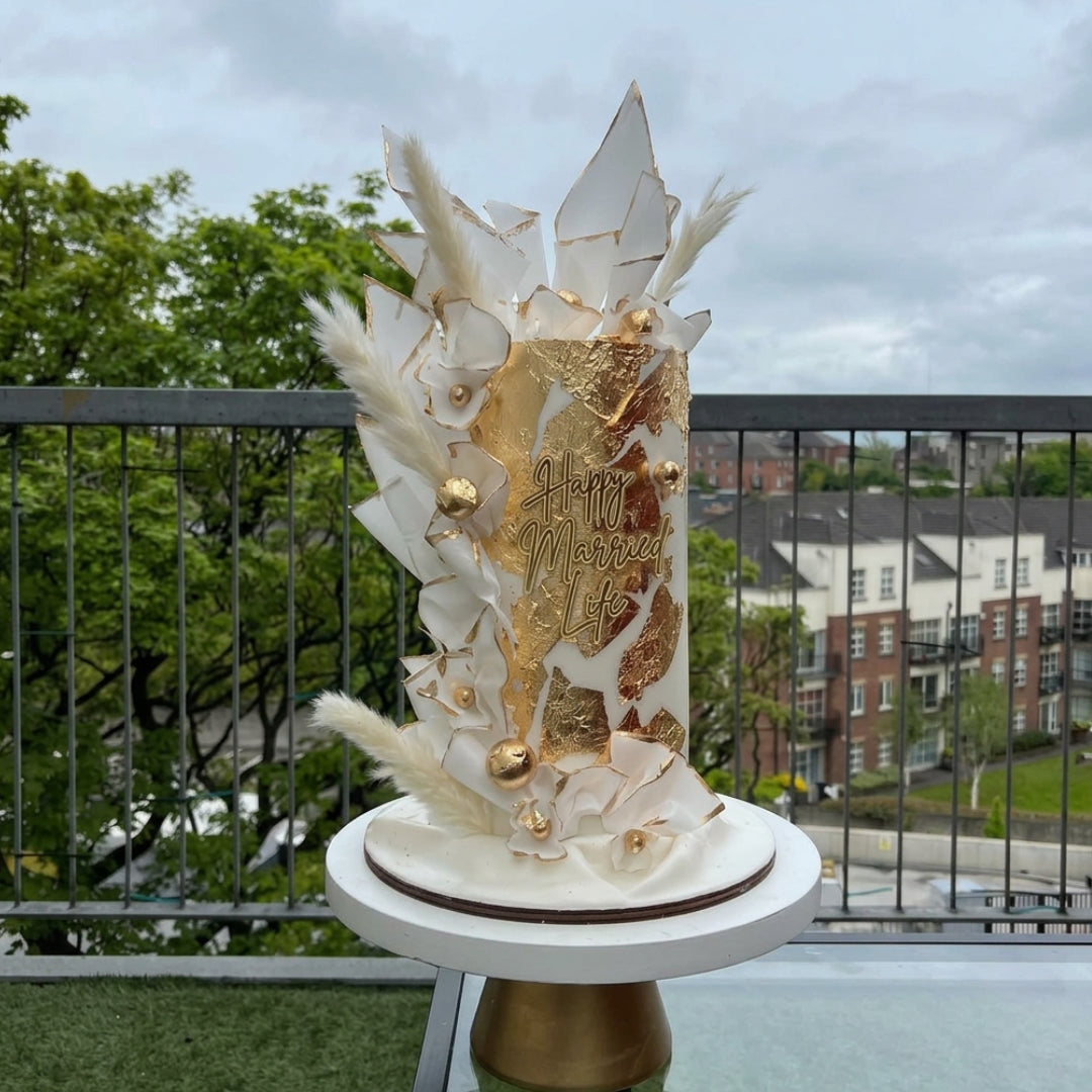 Wafer paper sail cake in white and gold with pampas grass and gold leaf panel, Dublin