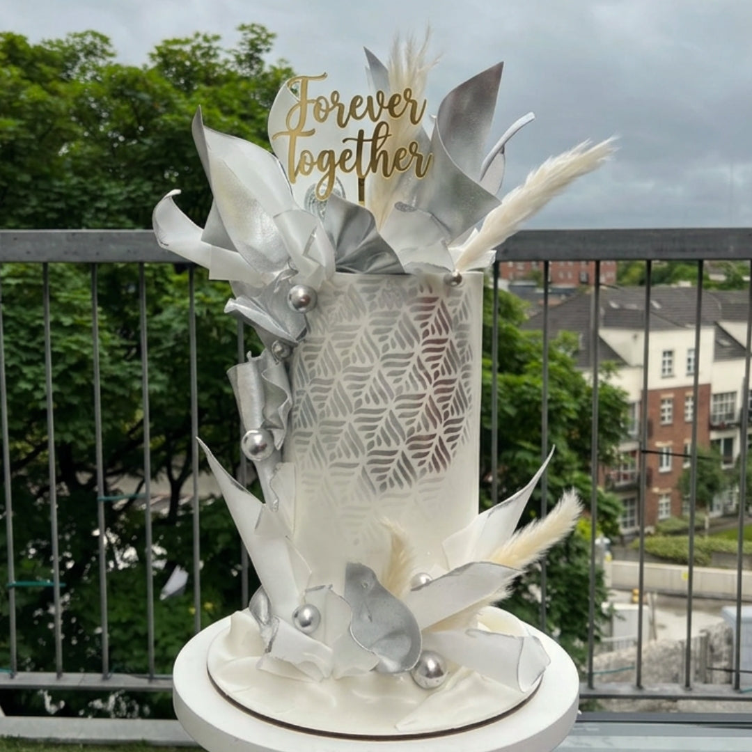 Silver and white wedding cake with stencilled leaf pattern and metallic wafer paper sails, CakeMeAway Dublin