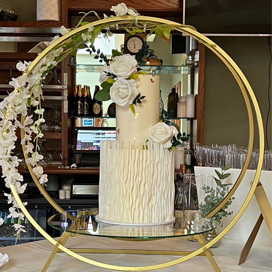 Two tier ivory wedding cake with hand-textured base tier, edible gold leaf and white roses, handmade in Dublin by CakeMeAway