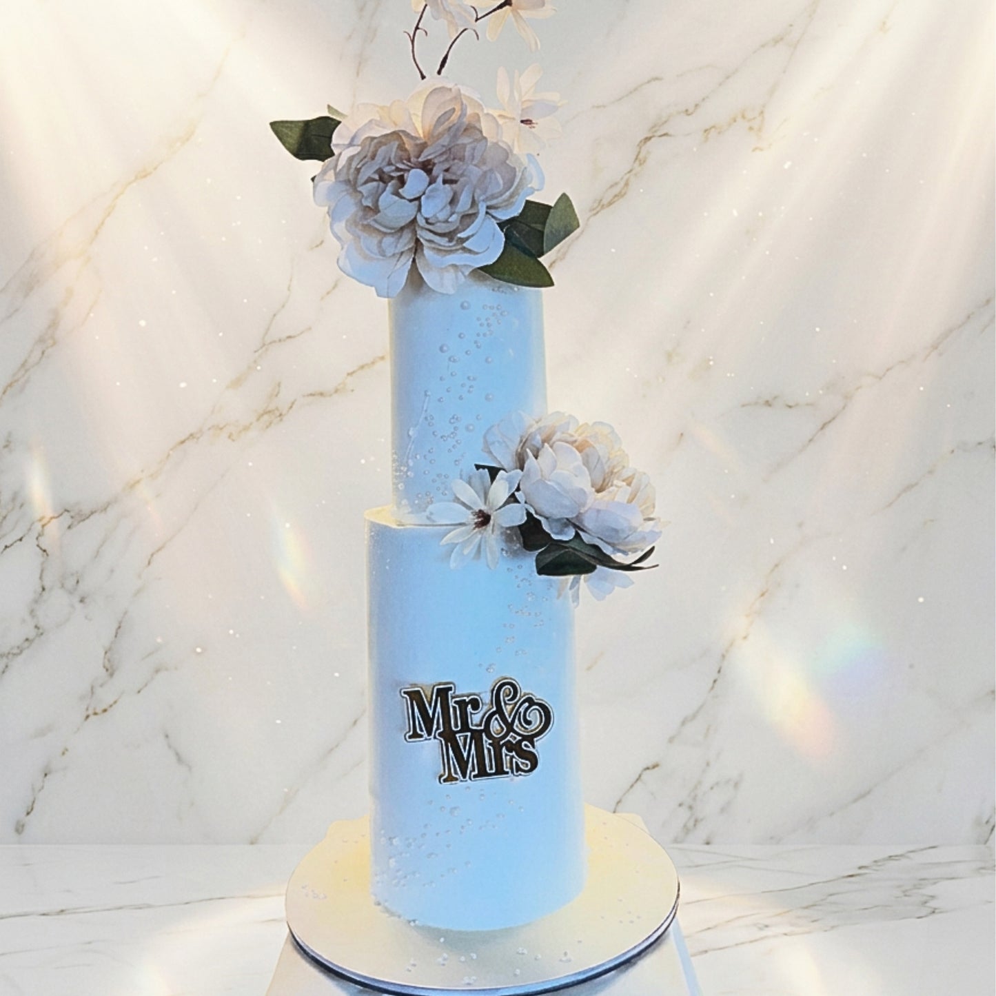 Two tier ivory wedding cake with sugar pearl detailing, peonies and a Mr and Mrs topper, handmade in Dublin by CakeMeAway
