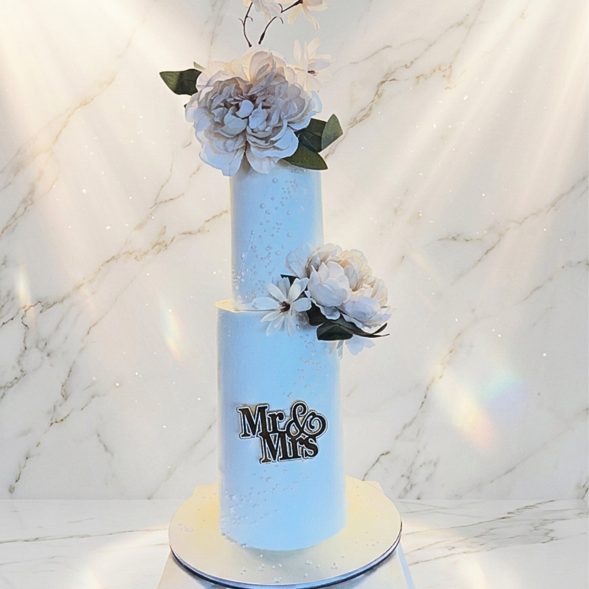 Two tier ivory wedding cake with sugar pearl detailing, peonies and a Mr and Mrs topper, handmade in Dublin by CakeMeAway