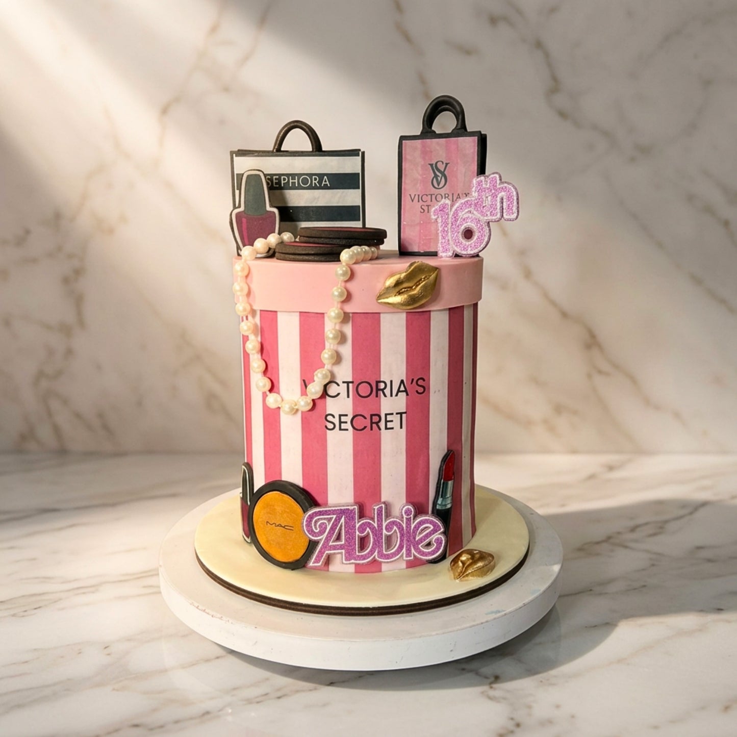 Pink striped beauty themed 16th birthday cake with pearls, lipstick and makeup decorations, handmade in Dublin