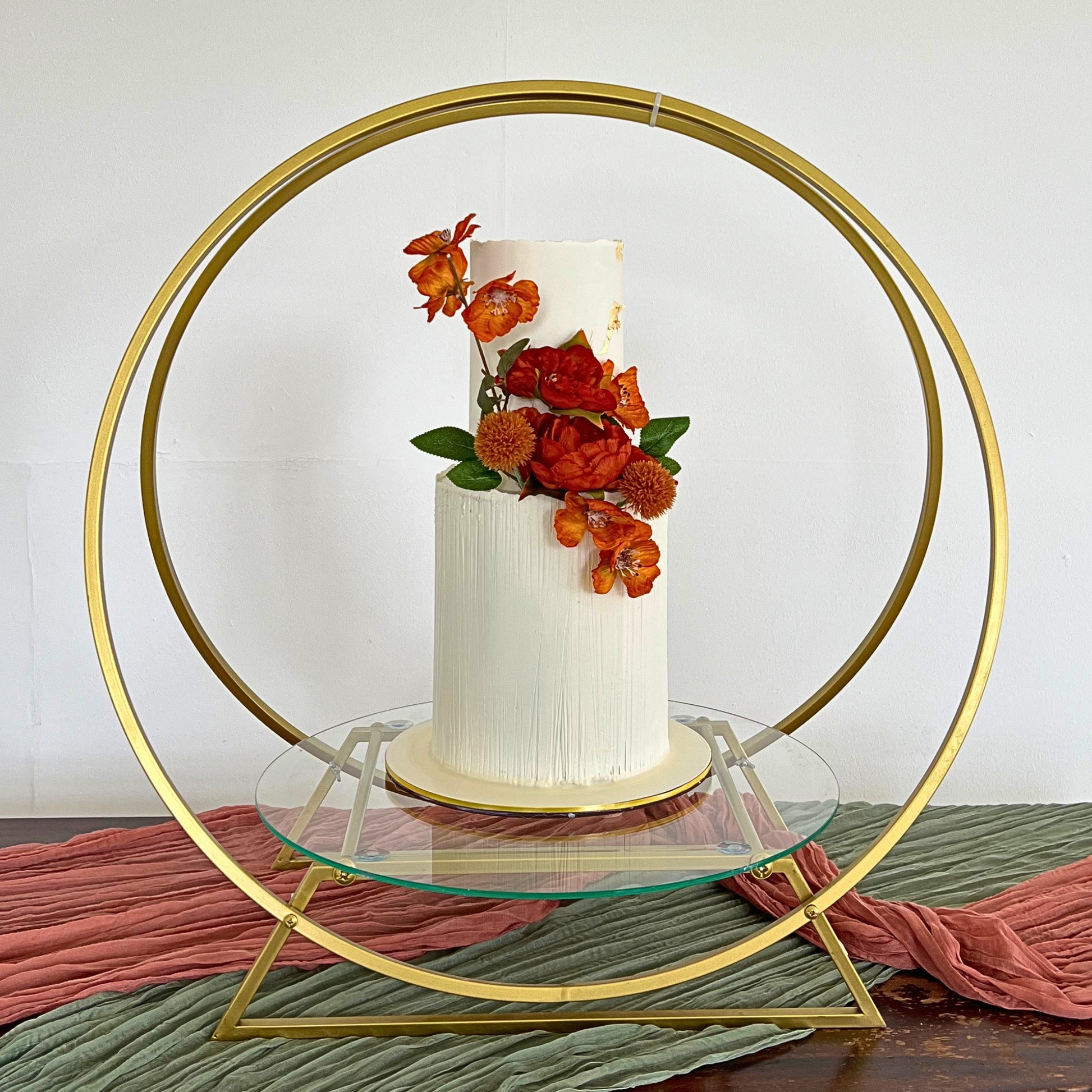Autumn floral wedding cake with terracotta blooms displayed on a gold hoop stand, CakeMeAway Dublin