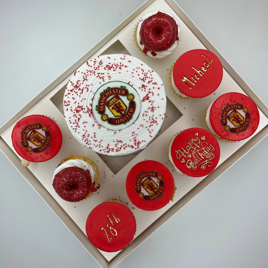 Close-up of a designer themed bento cake with intricate buttercream piping and matching artisan cupcakes.