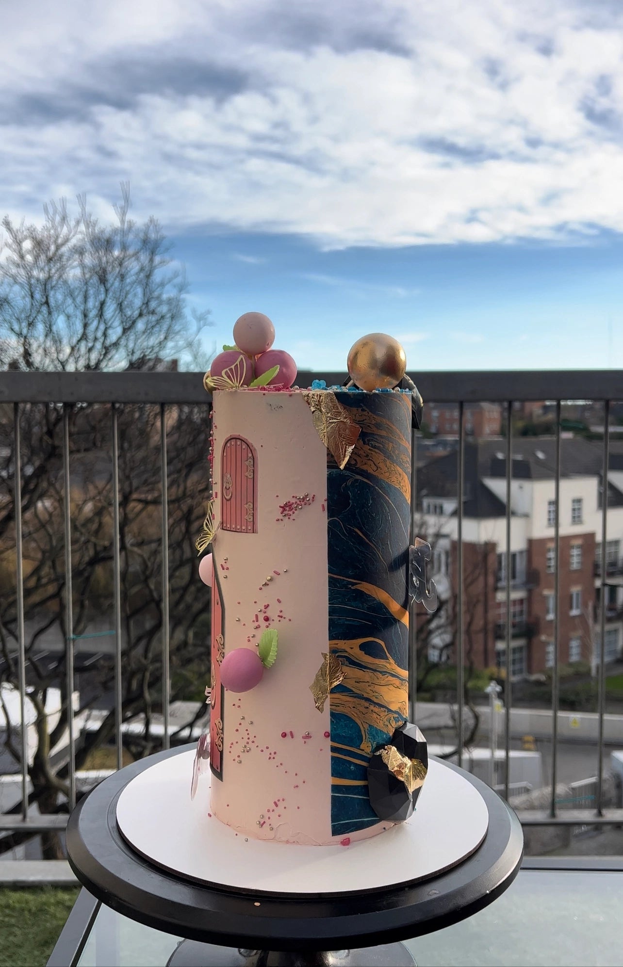 Custom half and half themed cake for a joint celebration, handcrafted by a Dublin bakery.