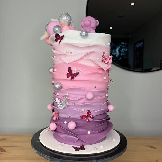 Elaborate baby showercake with a teddy bear
