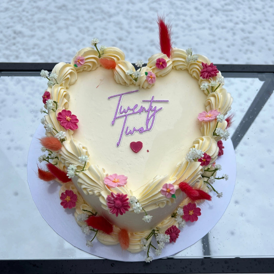 IVORY HEART CAKE WITH FONDANT AND ARTIFICIAL FLOWERS