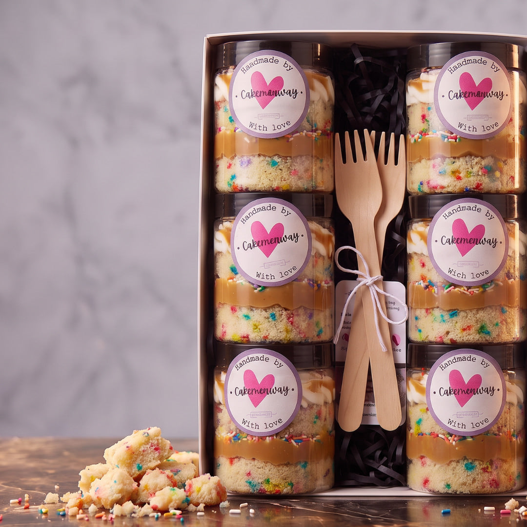 Funfetti birthday cake jars in a box of 6 with rainbow sprinkles, caramel and cream layers and wooden forks, CakeMeAway Dublin