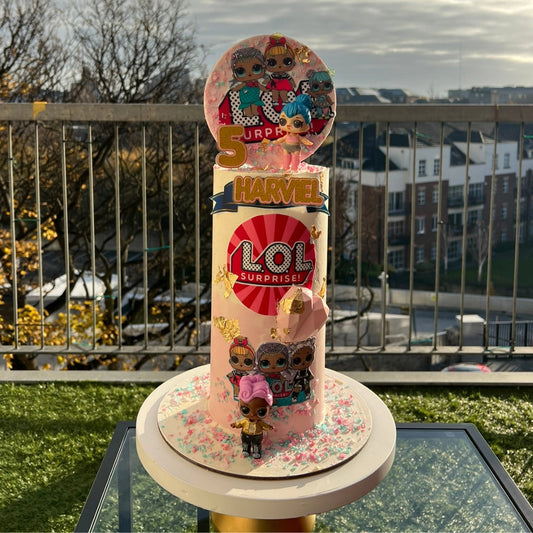 Pink and teal LOL Surprise themed buttercream cake with NON edible character toppers for a Dublin birthday party.
