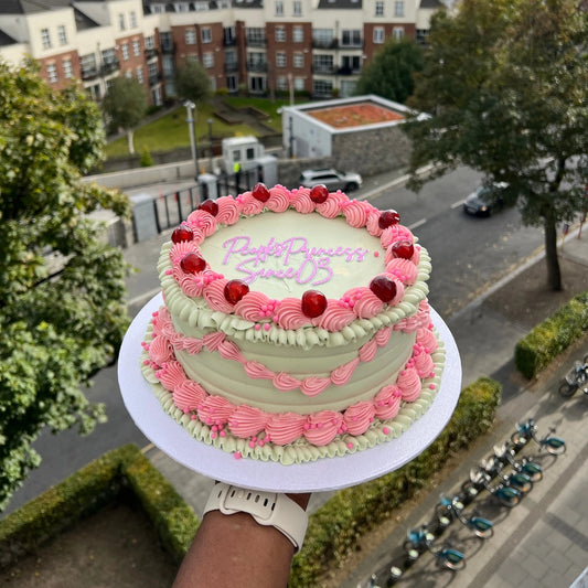 Pink and green vintage pipped buttercream cake
