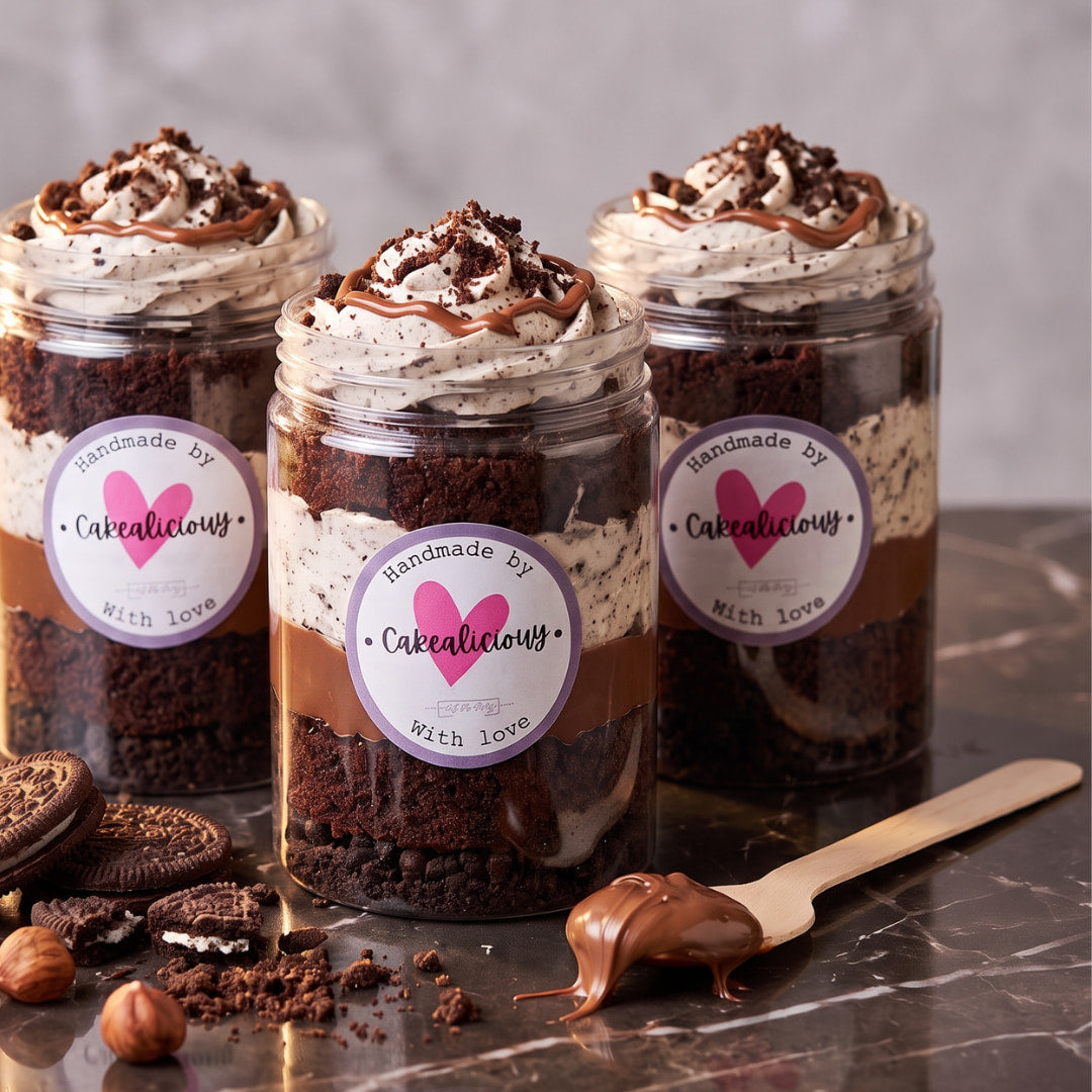 Three chocolate cookies and cream cake jars with a swirl of frosting, chocolate drizzle and cookie crumbs on top, CakeMeAway Dublin
