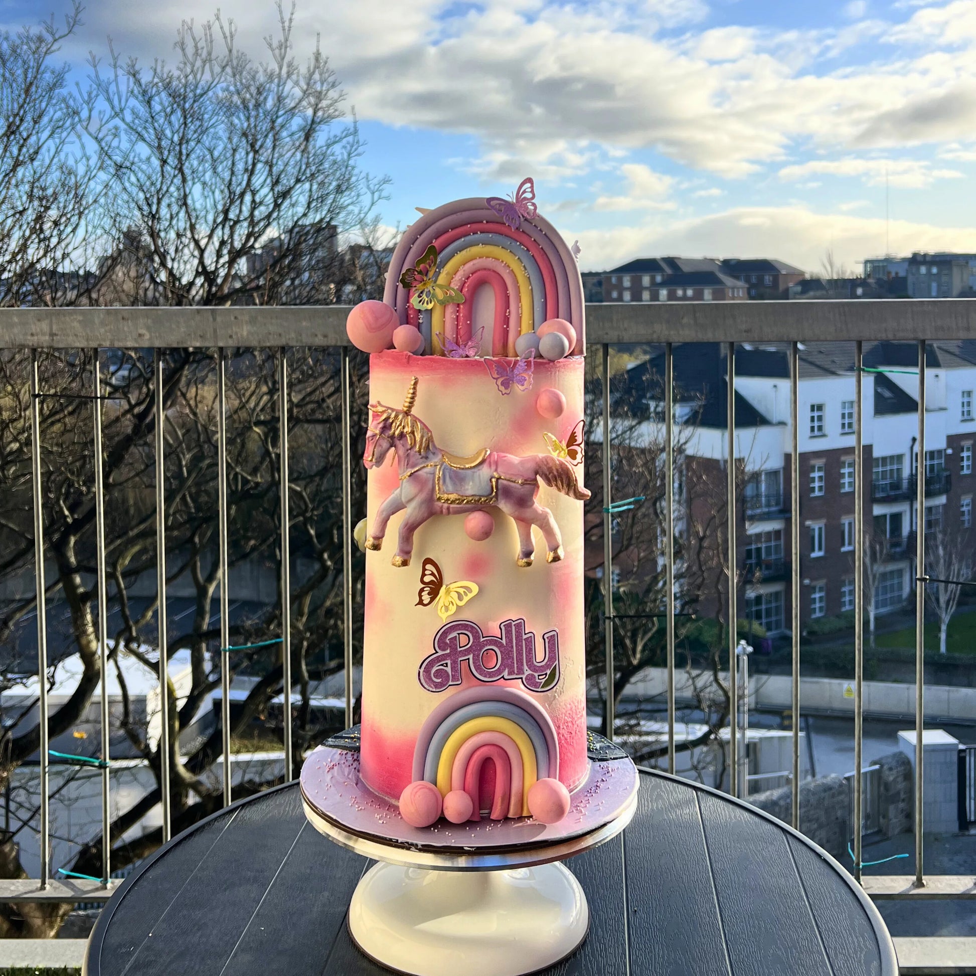 colourful rainbow and unicorn cake