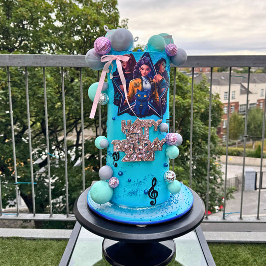 Tall turquoise K-pop themed birthday cake with mirror balls, sugar spheres and a personalised glitter topper, handmade in Dublin by CakeMeAway