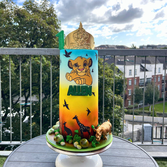 Tall lion and jungle birthday cake in gold and green with handcrafted safari detail, made in Dublin by CakeMeAway