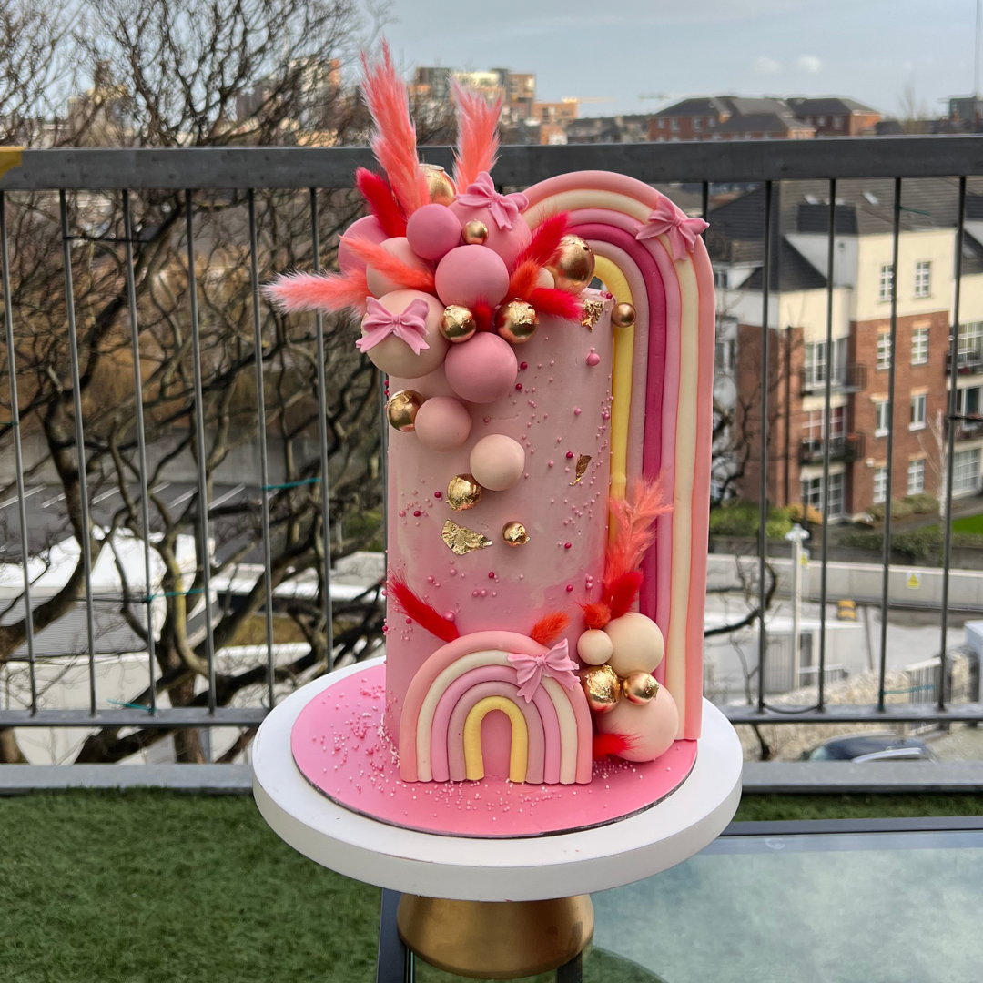 elaborate pastel pink cake with bows