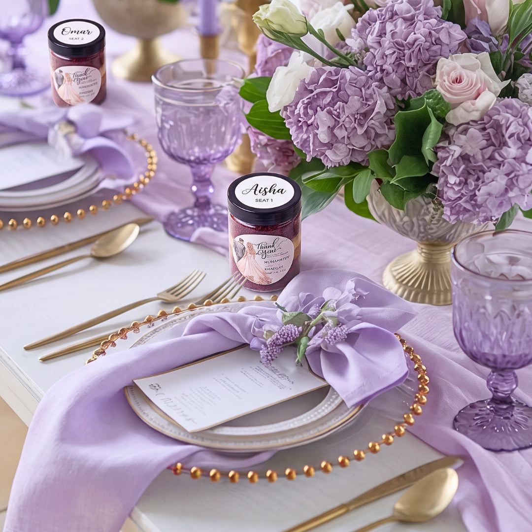 Lilac and gold wedding table with hydrangeas and personalised cake jar favours showing guest names and seat numbers on the lids, Dublin