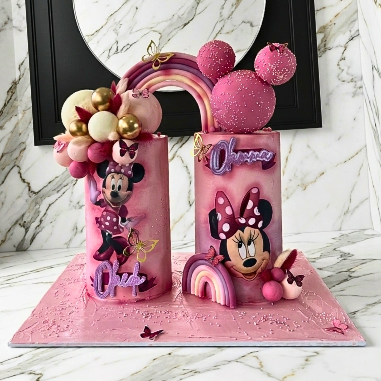 Pink double cake set with cartoon character panels and sphere garland, Dublin
