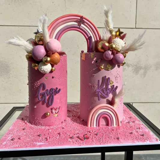 Two-in-one pink double cake set with fondant rainbow and personalised name toppers, handmade in Dublin by CakeMeAway
